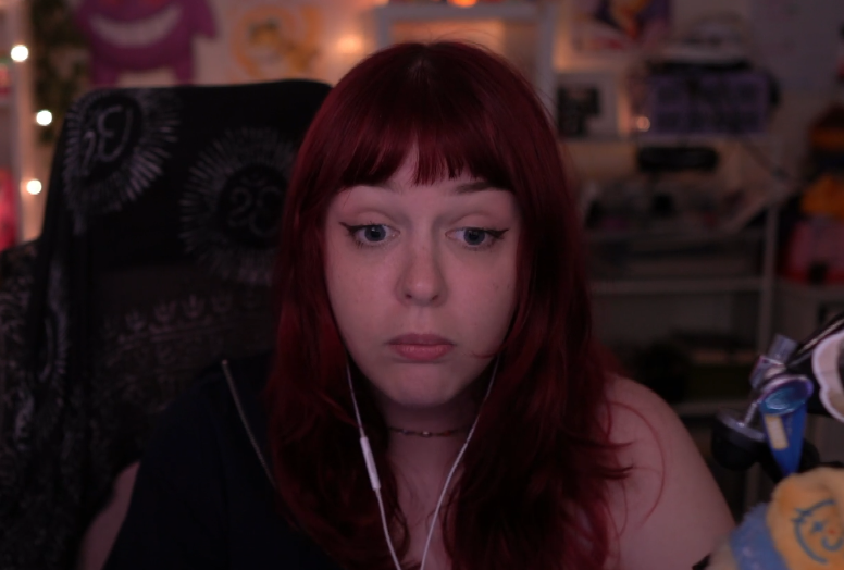 GwenMelon reacting on stream with red hair and a surprised expression.